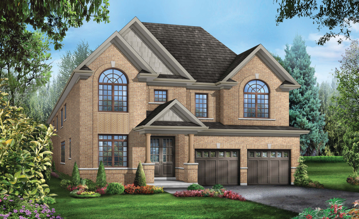 A two-story brick house with large arched windows, a dark shingled roof, and two garage doors. This pre-construction home is surrounded by a well-maintained garden with shrubs and colorful flowers, set against a backdrop of trees and blue sky.