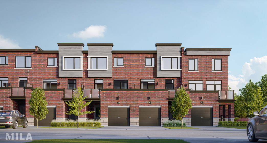 A row of modern new homes with red brick exteriors and large windows under a clear blue sky. Each unit features a balcony and a garage. Two cars are parked on the driveway, and small trees enhance the front of the buildings.