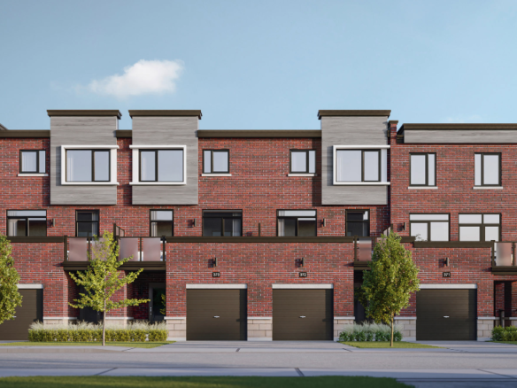 A row of modern two-story brick townhouses with large windows and attached garages, seen from the street, showcases new homes in Brampton. Two cars are parked on the road, while small trees and shrubs add charm to each townhouse front.