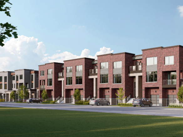 A row of new homes in a suburban neighborhood under a blue sky. These modern, three-story townhouses feature brick facades and large windows. Cars are parked along the street, and small trees line the sidewalk.
