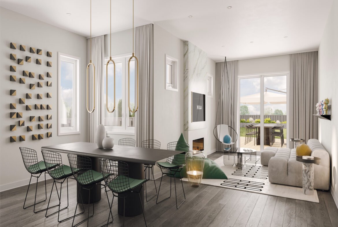 A modern family and dining room showcases a large dining table with black chairs, a light grey sofa adorned with cushions, and a wall-mounted TV. Decorative wall art, pendant lights, and large windows enhance the ambiance. Perfect for new homes in vibrant communities like Brampton.