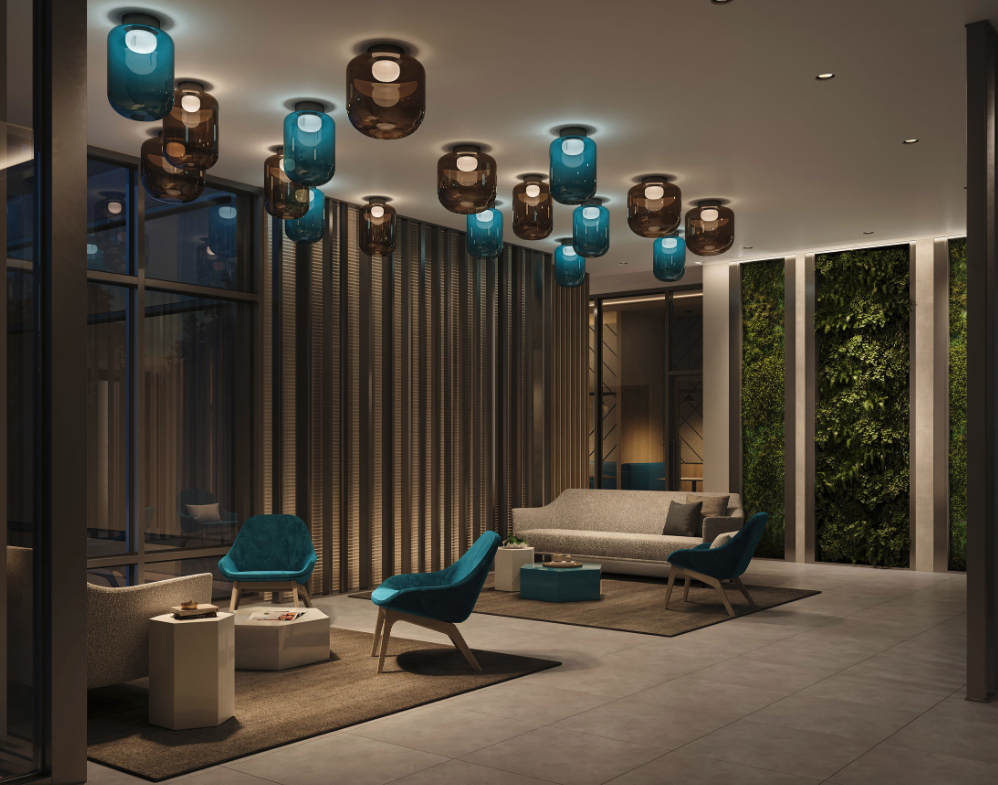 The modern lobby boasts contemporary furniture, featuring blue and brown chairs, sofas, and small tables on a tiled floor. The ceiling showcases blue and brown pendant lights, while a vertical garden enhances one wall's elegance. Explore the charm of new homes in Toronto with this inviting design.