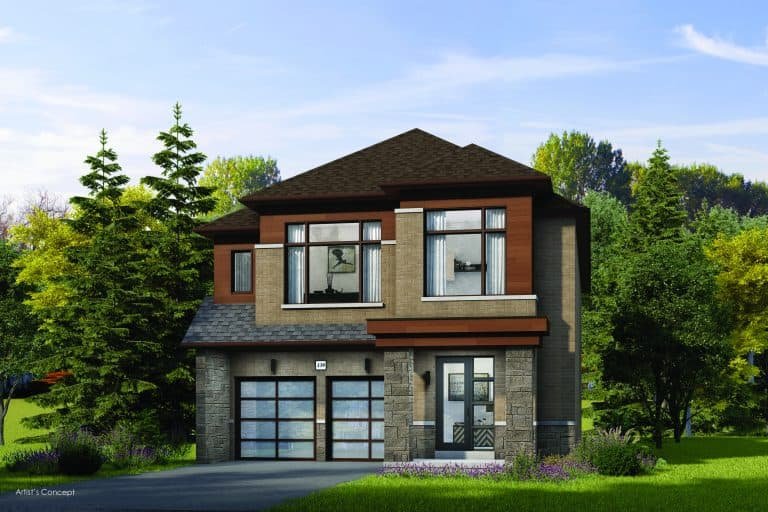 A modern two-story house with brick and wood accents, part of the Oakridge Green Homes development, features large windows and a double garage. It's surrounded by verdant trees and grass, with a clear blue sky above.