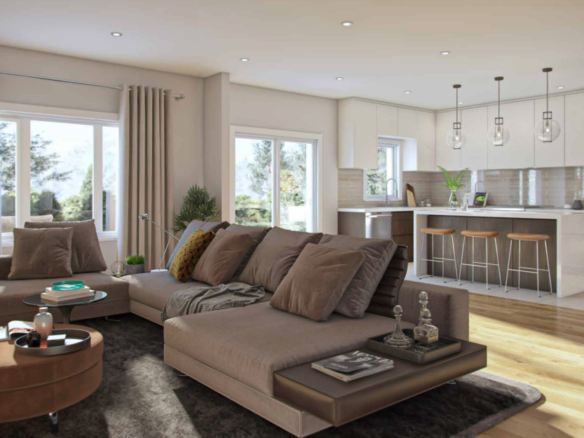 Discover a modern living room in this new home in Brampton, featuring a beige sectional sofa with brown pillows centered around a round coffee table. Large windows flood the space with natural light, and the open kitchen boasts bar stools at a counter and sleek stainless steel appliances.