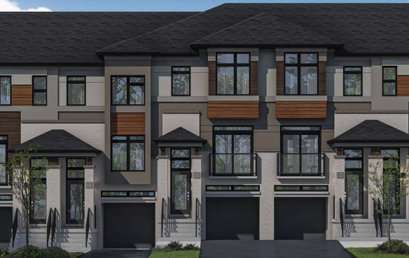 A row of new homes in Brampton with a blend of beige, gray, and wood panel exteriors. Each unit features large windows, a black shingled roof, and attached garages. The surrounding area is adorned with lush greenery under a clear blue sky.