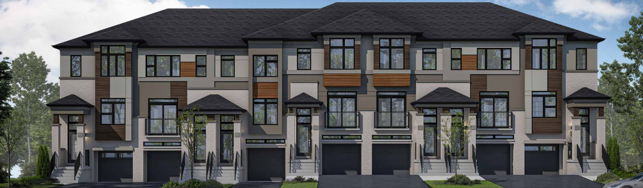 A row of new homes in Brampton with a blend of beige, gray, and wood panel exteriors. Each unit features large windows, a black shingled roof, and attached garages. The surrounding area is adorned with lush greenery under a clear blue sky.