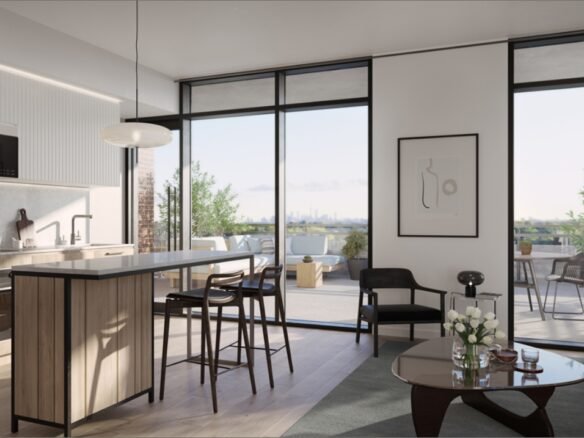 Discover a modern open-concept living space featuring a kitchen island with stools, a cozy sofa, and a coffee table. Large windows lead to a balcony offering breathtaking city views. The decor includes captivating wall art and lush potted plants, perfect for those exploring new condos in the GTA.
