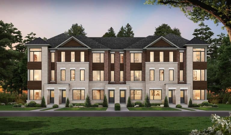 A modern townhouse complex in South Barrie Towns features three connected units, large windows, a brick and stone facade, and landscaped greenery. The scene is beautifully set against a backdrop of trees at dusk. A modern townhouse complex in South Barrie Towns features three connected units, large windows, a brick and stone facade, and landscaped greenery. The scene is beautifully set against a backdrop of trees at dusk.