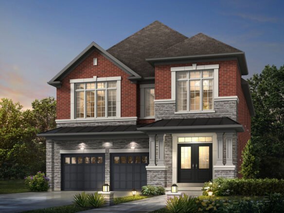 A two-story house with a red brick and gray stone exterior features two garage doors, large windows, and a welcoming porch. The landscaped front yard is adorned with shrubs and lit by small pathway lights. Perfect for those seeking new homes in Brampton, the setting is beautifully captured at dusk.