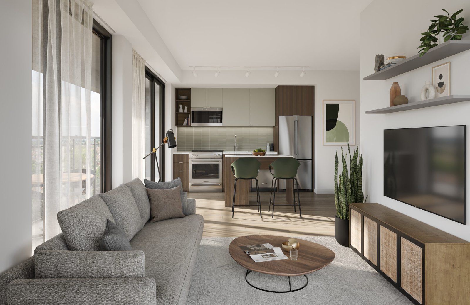 A modern living room and kitchen area with floor-to-ceiling windows in one of Toronto's new homes. It features a gray sofa, round wooden coffee table, wall-mounted TV, and a kitchen with green and brown cabinets. A plant and bar stools add accents to the space.