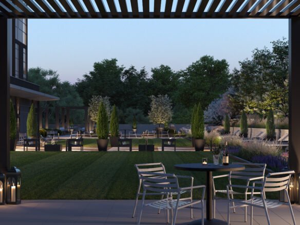 A modern outdoor patio at dusk features metal chairs and tables, embraced by lush greenery and tall potted plants. Soft lighting and lanterns add coziness. In the background, trees frame a softly lit building, hinting at the elegance of new homes.