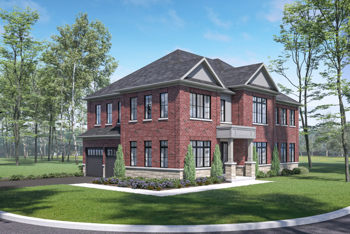 A two-story red brick house with large windows is surrounded by a green lawn and trees. The property boasts a dark gray roof, a small garden with shrubs, and a driveway. This picturesque setting is similar to the emerging new homes in Brampton, reflecting modern design on a clear sunny day.