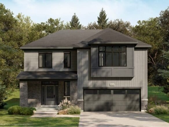 A modern two-story house with a dark gray exterior, large windows, and a double garage door stands elegantly amidst lush greenery. Surrounded by trees in a tranquil conservancy setting, it features a neatly manicured lawn in the front.