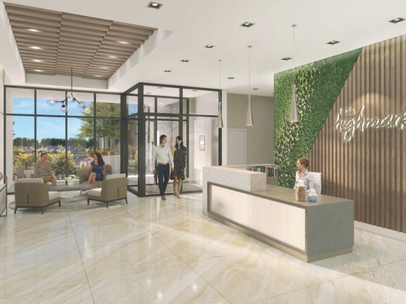 The modern office reception area features a receptionist at a desk, three individuals entering through glass doors, and two people seated on sofas. The stylish decor includes a green vertical garden and a wood accent wall with "Highmark." It's reminiscent of new homes in Brampton with its contemporary design.