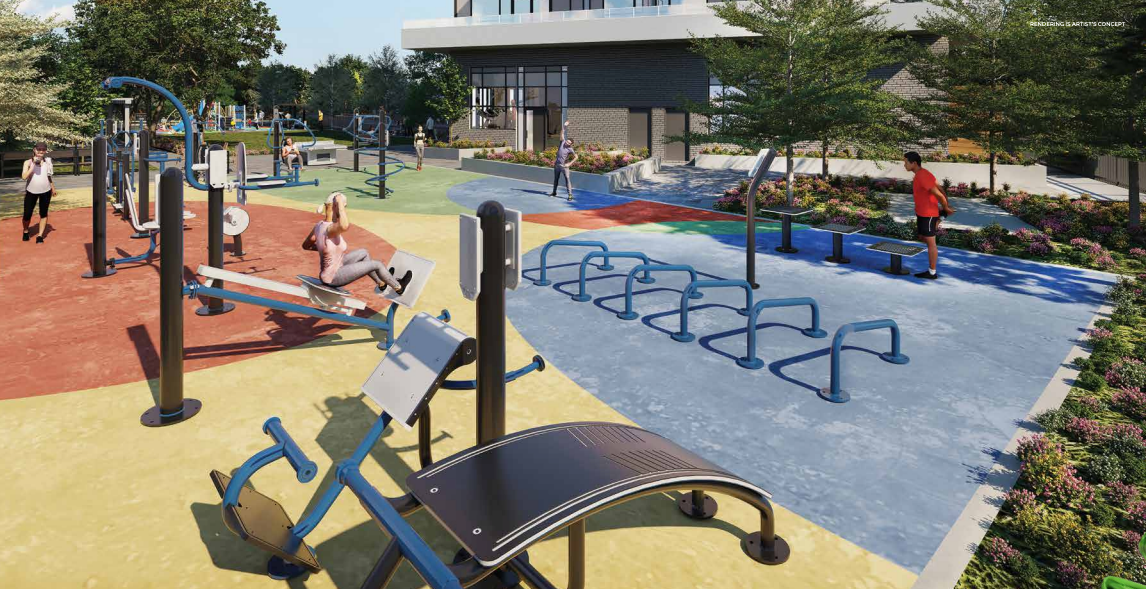 Outdoor fitness park with exercise equipment on colorful rubber flooring. People are using various workout stations surrounded by trees and flowers, creating a serene atmosphere. In the background, the sleek architecture of new homes in Brampton adds a modern touch to the landscape.