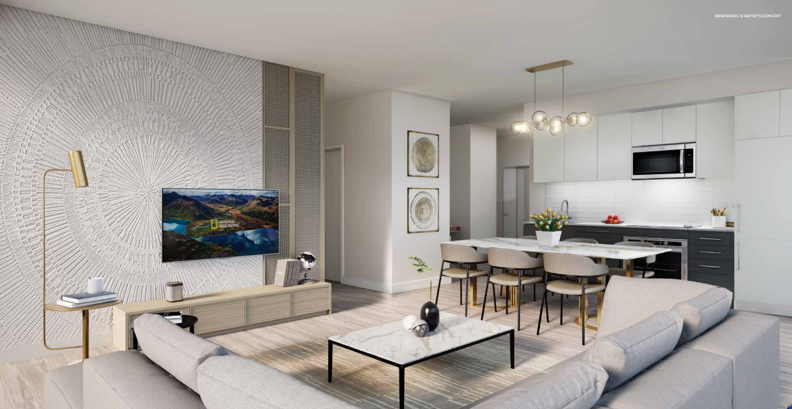 Discover a contemporary living room and kitchen in one of the new homes in Brampton. Enjoy neutral tones with a textured wall showcasing a TV, a beige L-shaped sofa, and a sleek white coffee table beside a standing lamp. The kitchen boasts white cabinetry, a dining table for six, and stylish pendant lighting.