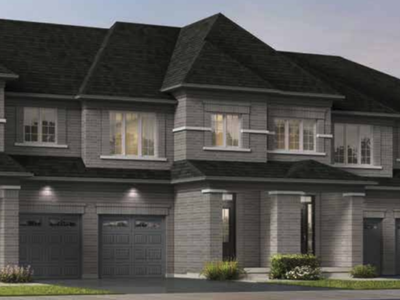 Discover the charm of modern townhouses with multiple units, each boasting two stories, large windows, and attached garages. Featuring a stylish gray brick exterior and small front lawns with minimal landscaping, these new homes in Brampton offer the perfect blend of comfort and style.