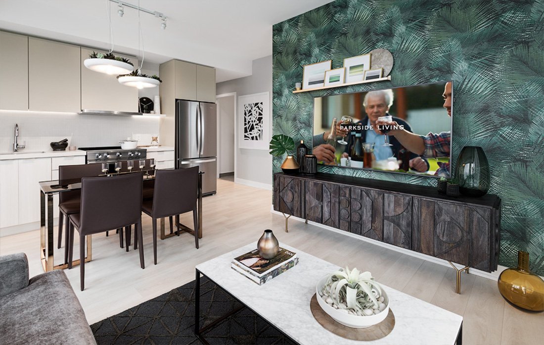 Discover modern elegance in this open-plan kitchen and living area, perfect for new homes in Toronto. It features sleek white cabinets, stainless steel appliances, and a dining table. The living room boasts a green accent wall, TV, decorative wooden console items, and a welcoming coffee table with plants.