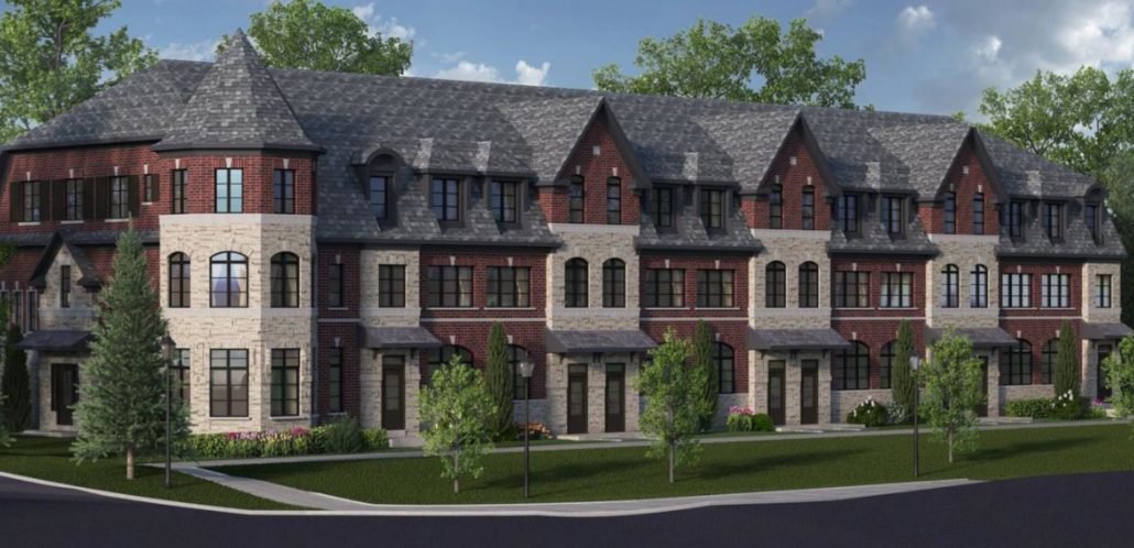 A row of elegant townhouse-style buildings with red brick and stone facades, featuring large windows and peaked roofs. Trees and neatly manicured lawns line the sidewalk in front of the buildings under a partly cloudy sky, embodying the charm of new homes in Toronto.