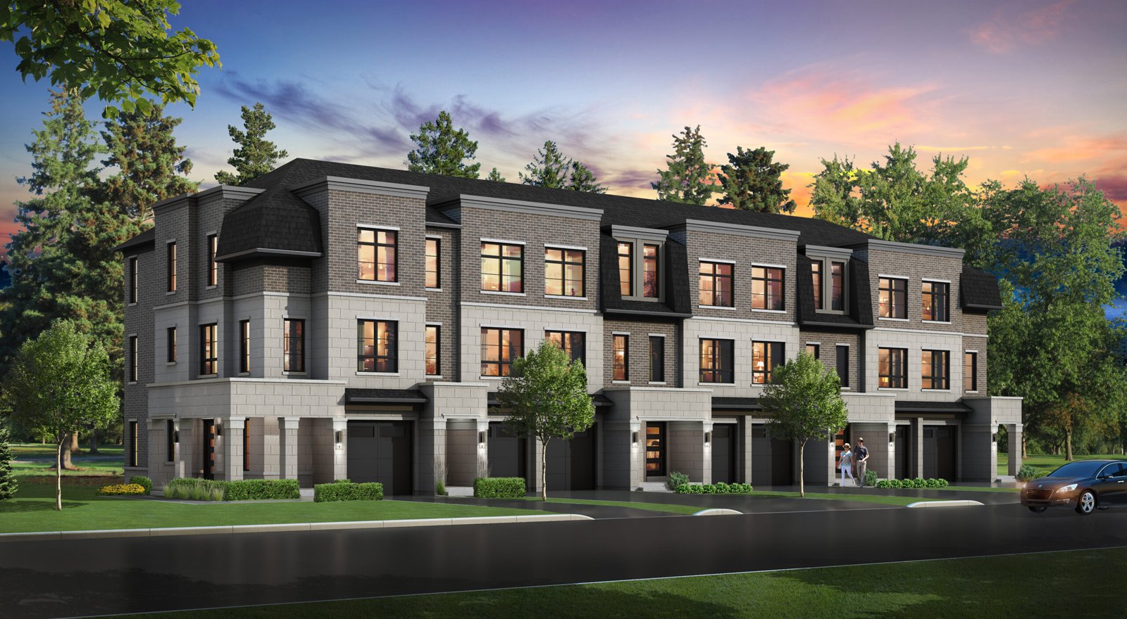 Set against a vibrant sunset sky, this modern three-story townhouse complex in Brampton boasts large windows and a striking brick exterior. Surrounded by tall trees, it offers the charm of new condos while a car is parked neatly to the right.
