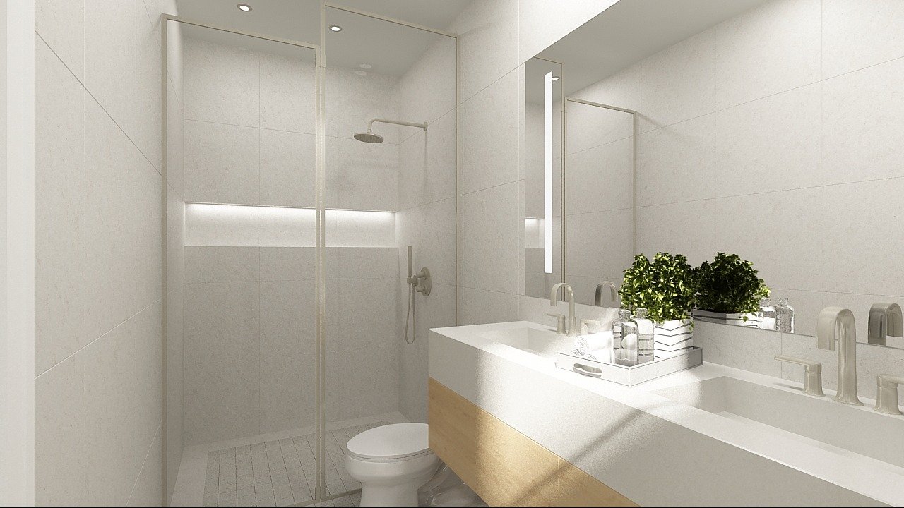 Discover this sleek, modern bathroom in a new home in Toronto. It boasts a spacious walk-in shower with a glass door and a white toilet beside a large countertop with dual sinks. A potted plant injects greenery into the minimalist design, while neutral tones enhance the clean aesthetic.