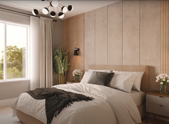 A modern bedroom in new homes offers a bed with white and gray bedding. A plant and nightstand with flowers sit on one side, while a large window provides a view of trees. The room is adorned with wood paneling, wall lamps, and a contemporary ceiling light fixture.