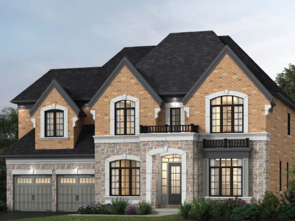 A large, two-story pre-construction home with a light brick and stone exterior. It features multiple windows, two garages with gray doors, and a neatly manicured lawn. The steep, dark roof boasts a small balcony over the entrance—a prime example of new homes in the GTA by SG Homes.