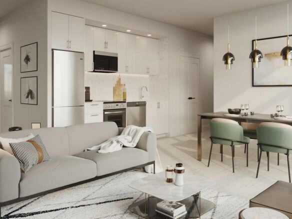 A modern open-plan living and dining area in new homes features a gray sofa with a throw blanket, a marble-top coffee table, and a dining table with green chairs. The kitchen boasts white cabinets and stainless steel appliances, while pendant lights elegantly hang above the dining area.