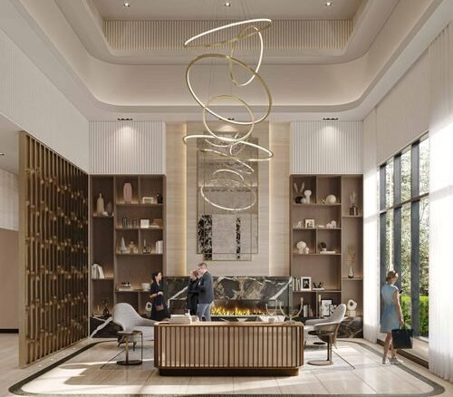 A modern hotel lobby featuring a large abstract light fixture, a central reception desk, and tall shelves displaying art pieces has a sleek design reminiscent of new condos in GTA. Two people converse near the desk while a woman stands illuminated by natural light streaming from the window.