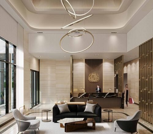 Modern hotel lobby with elegant design, featuring a black sofa, two gray chairs, and a unique wooden coffee table. A receptionist is at the desk, and large windows allow natural light to illuminate the space. With an eye-catching circular chandelier above, it embodies the sophistication of new condos in GTA.