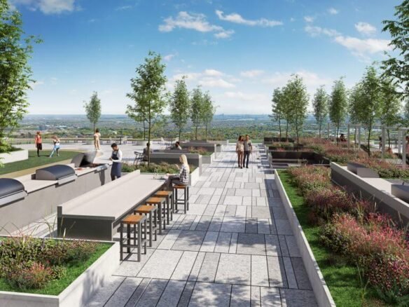 Sg Homes presents a rooftop terrace where people gather amidst lush trees and plants. Patrons enjoy tables and stools along a paved walkway, all while taking in the scenic view of the horizon and blue sky—your serene escape amidst stunning new homes in GTA.