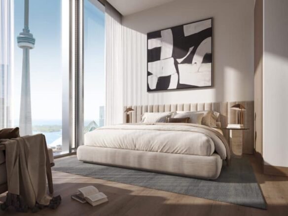 Modern bedroom with minimalist decor featuring a large bed with a beige upholstered headboard, two wooden nightstands with lamps, and geometric black-and-white artwork above the bed. Floor-to-ceiling windows offer a view of the cityscape, including a tower—a signature detail of Freed Hotel Residences.