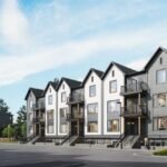 A row of modern, three-story townhouses designed by SG Homes stands with gabled roofs and large windows. The buildings, painted in neutral colors, overlook a mostly empty parking lot with a few cars. Under the clear blue sky, these pre-construction homes exude contemporary charm.