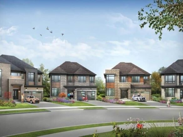 A row of modern two-story houses with brick exteriors and large windows line a suburban street, resembling new condos. Each house has a driveway with parked cars. The landscape is neatly maintained, with colorful flowers and green lawns. Birds soar in the clear blue sky above.