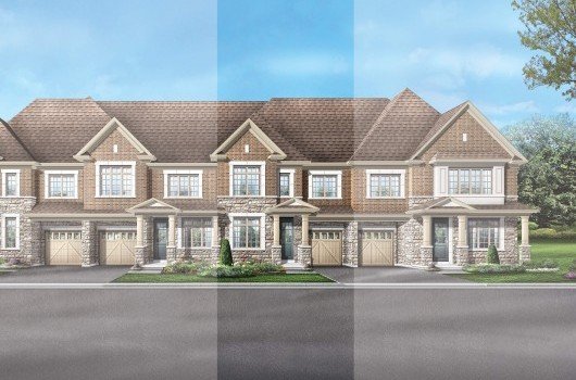 In Anchor Woods, a row of large, two-story suburban townhouses with brown roofs and stone accents stands proudly. Each unit has its own garage and driveway. Multiple windows allow light to flood in, while the landscaping features grass and small shrubs. Above, the sky is blue with scattered clouds.