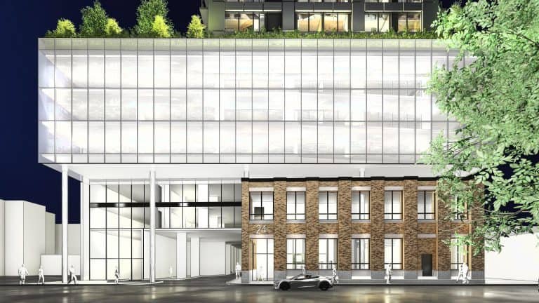 Modern building at night blending glass and brick architecture. The lower section features brick with tall windows, while the sleek, glass-fronted upper part exudes elegance. A few trees adorn the rooftop of these new homes in GTA. A car is parked in front as people stroll by. Modern building at night blending glass and brick architecture. The lower section features brick with tall windows, while the sleek, glass-fronted upper part exudes elegance. A few trees adorn the rooftop of these new homes in GTA. A car is parked in front as people stroll by.