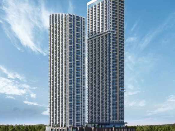 Artist rendering of two modern high-rise buildings against a blue sky with scattered clouds. These sleek towers, representing new homes in GTA, are surrounded by lush greenery and trees at their base, offering a glimpse into the future of urban living.