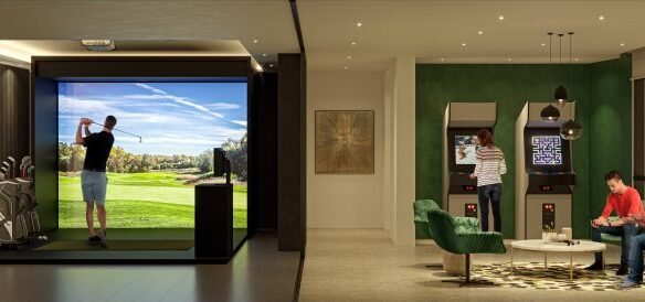 A modern indoor entertainment room in new GTA condos, featuring a golf simulator, two people playing on arcade machines, and two others seated around a table. The space is stylishly decorated with green chairs and framed artwork, offering a glimpse into the vibrant lifestyle of pre-construction homes.