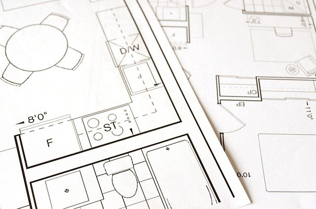 Floor plan drawings illustrate a kitchen layout with appliances labeled "F" and "ST," alongside a bathroom featuring a toilet and bathtub. Additional sections, ideal for those seeking renovation tips, showcase various measurements in the background.