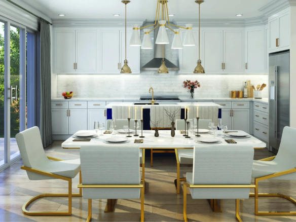 Modern kitchen and dining area at CALEDON CLUB, featuring white cabinetry, gold accents, a central dining table for six, large windows and glass doors for natural light, plus decorative lighting above the table and island.