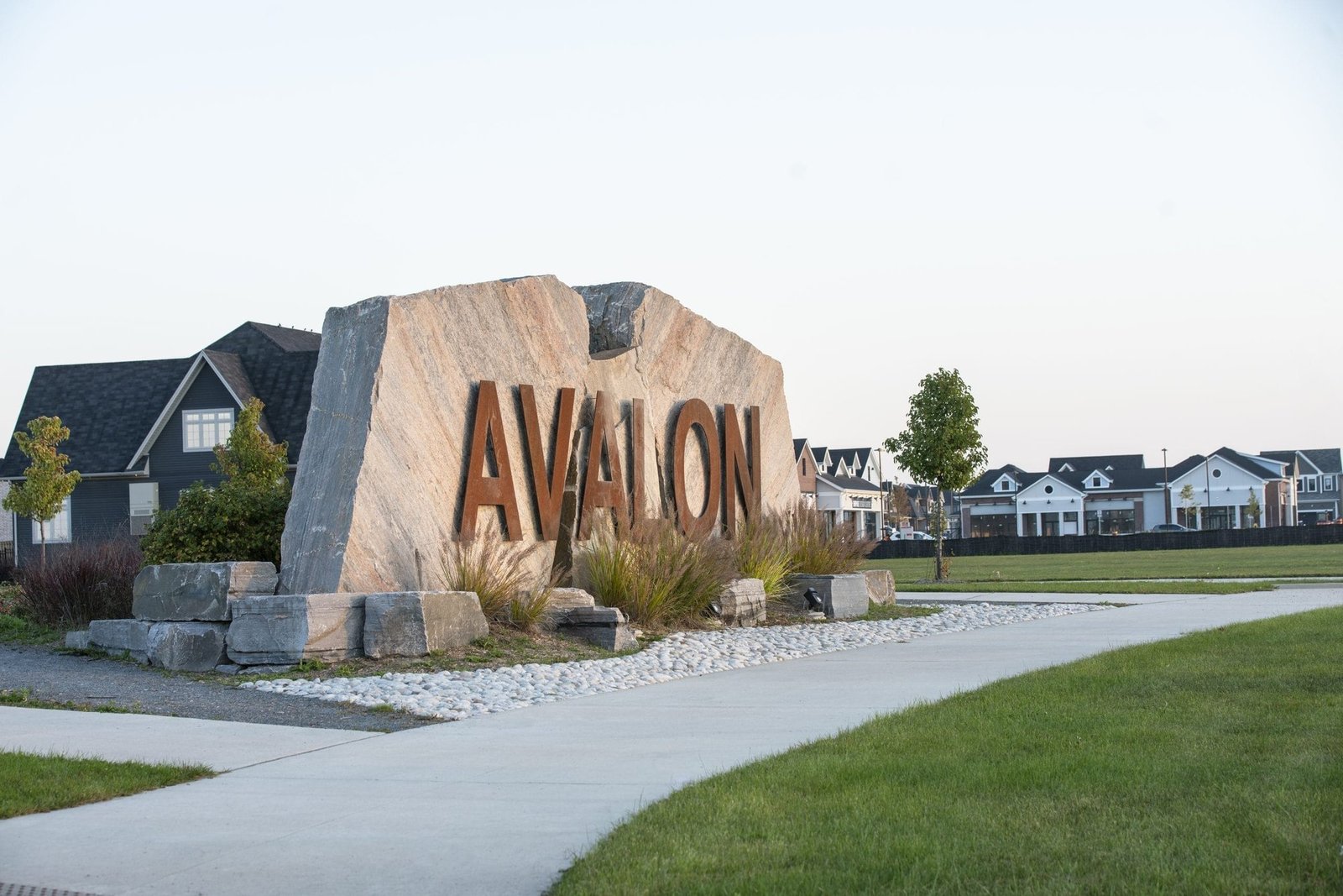 Grand entrance monument and gateway at Empire Avalon in Caledonia