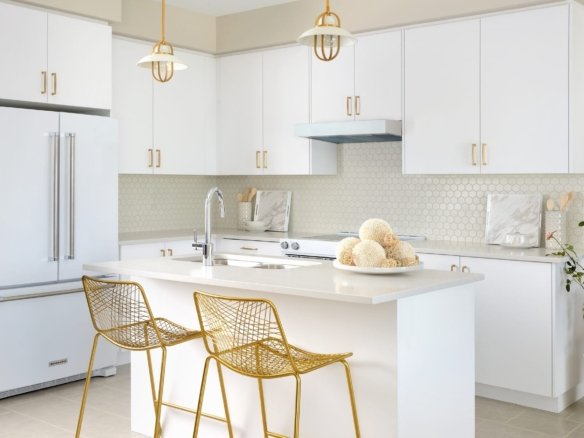 Open-concept modern kitchen with premium quartz countertops at Empire Avalon