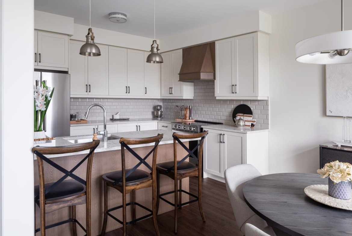 Modern kitchen layout featuring custom cabinetry and premium appliances at Empire Calderwood