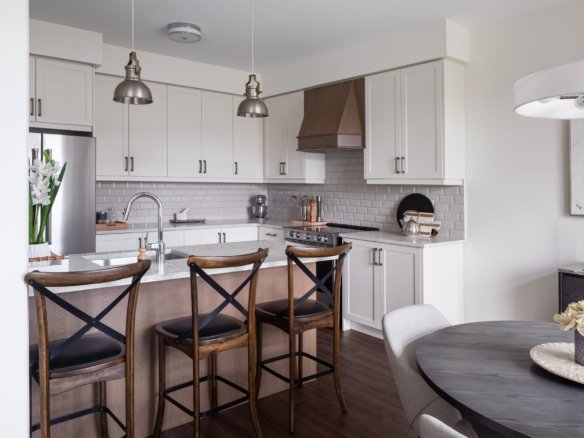 Modern kitchen layout featuring custom cabinetry and premium appliances at Empire Calderwood