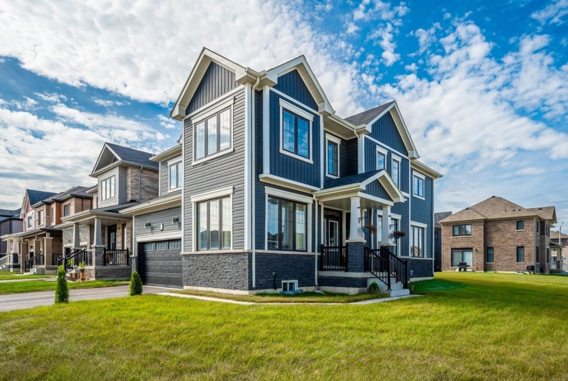 Peaceful family-friendly streetscape with completed homes and tree-lined sidewalks at Empire Calderwood