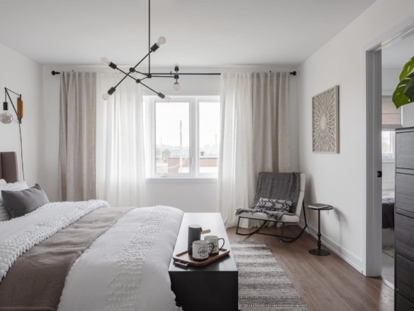 Spacious primary bedroom suite with large walk-in closet and designer finishes at Empire Calderwood