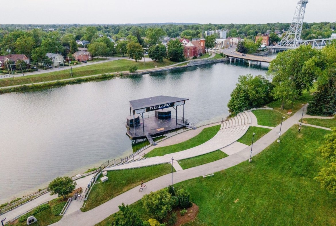 Family-friendly streetscape with completed townhomes and single-family residences at Empire Canals