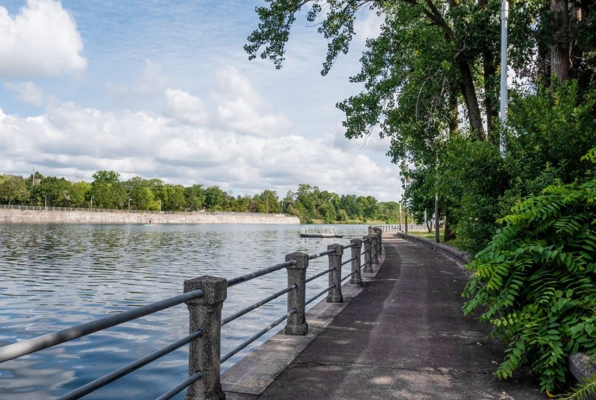 Scenic waterfront boardwalks and tranquil water-inspired parks along the canal at Empire Canals