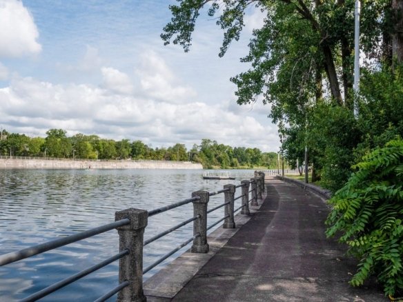 Scenic waterfront boardwalks and tranquil water-inspired parks along the canal at Empire Canals