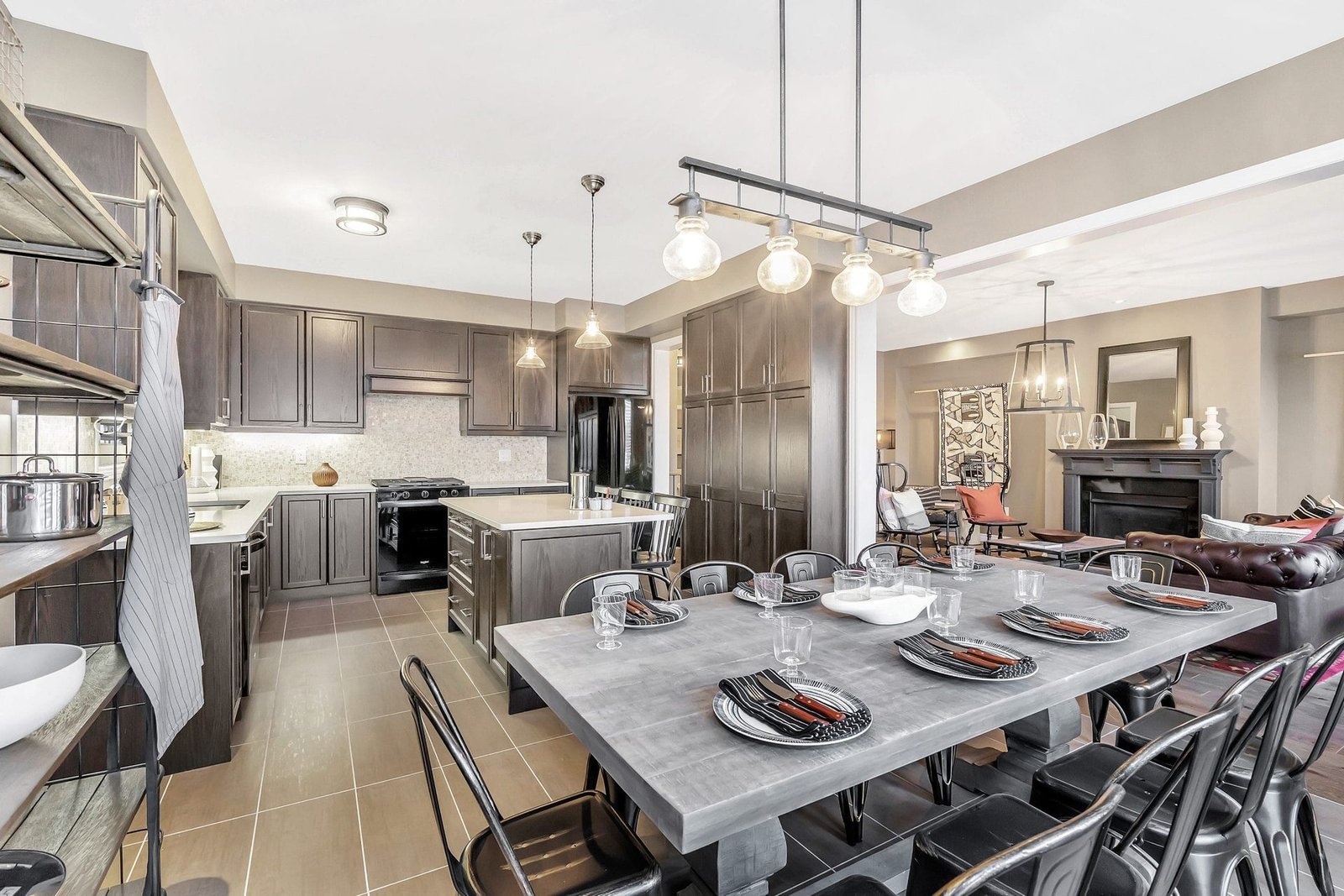 Bright and spacious designer living room featuring expansive windows and hardwood flooring at Empire Legacy